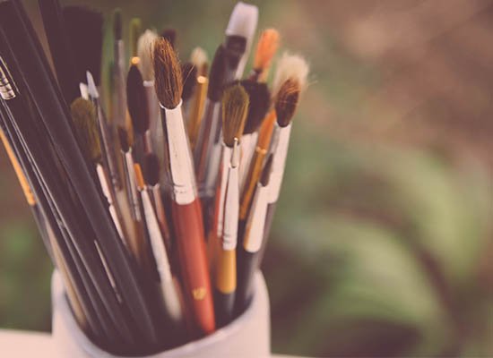 paintbrushes in can